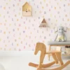 Kids room pink wallpaper with colorful alphabet pattern.