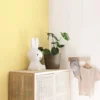 Yellow and beige plain textured wallpaper for kids' bedroom or nursery.